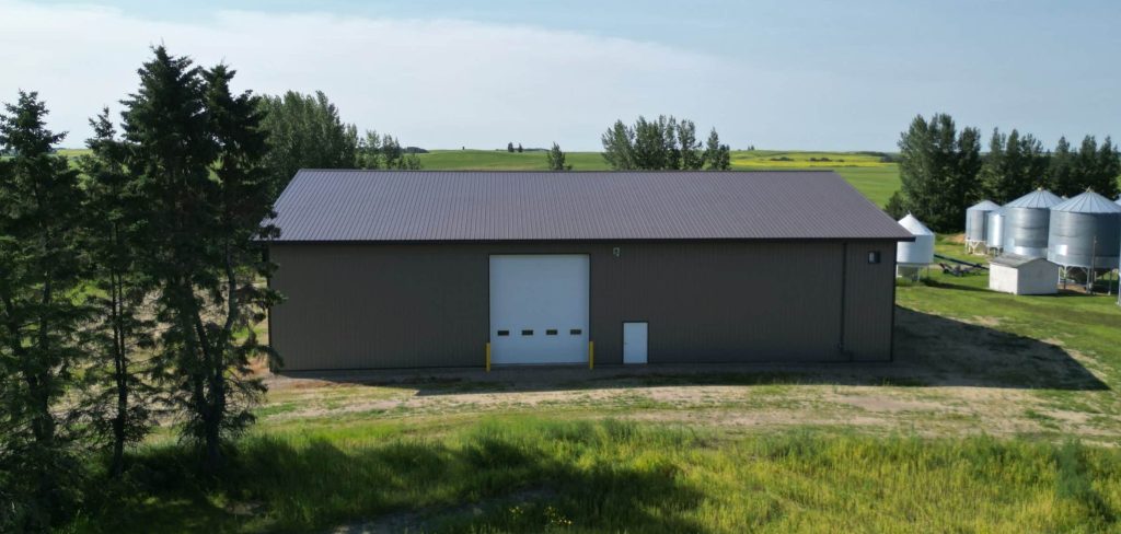 A Buckskin post-frame agriculture building with a bi-fold and overhead doors