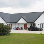 Explore the custom Homestead with loft built for Tyler near Kindersley, SK. Features upgraded Board and Batten Bright White siding and a functional, high-capacity design.