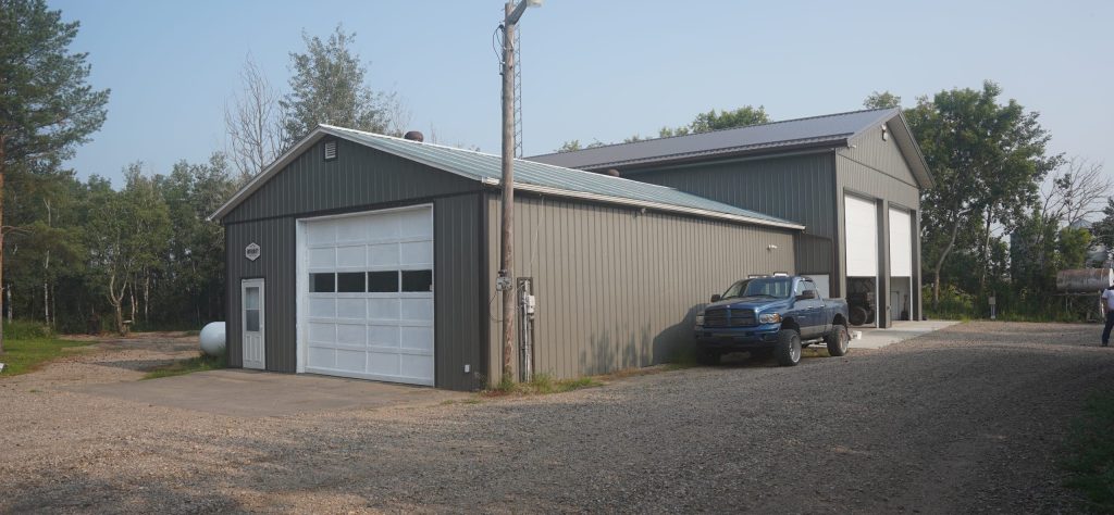 A Sable custom post-frame storage building with overhead doors