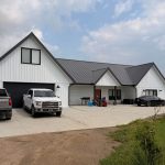 Explore the custom Homestead with loft built for Tyler near Kindersley, SK. Features upgraded Board and Batten Bright White siding and a functional, high-capacity design.