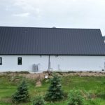 Explore the custom Homestead with loft built for Tyler near Kindersley, SK. Features upgraded Board and Batten Bright White siding and a functional, high-capacity design.