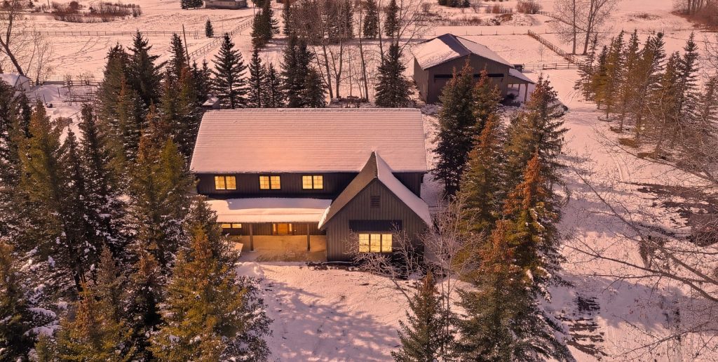 A dark brown custom post-frame residential home