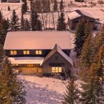 A dark brown custom post-frame residential home