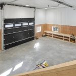 A dark brown lifestyle shop with an open lean-to and awnings