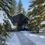 A black post-frame guest house