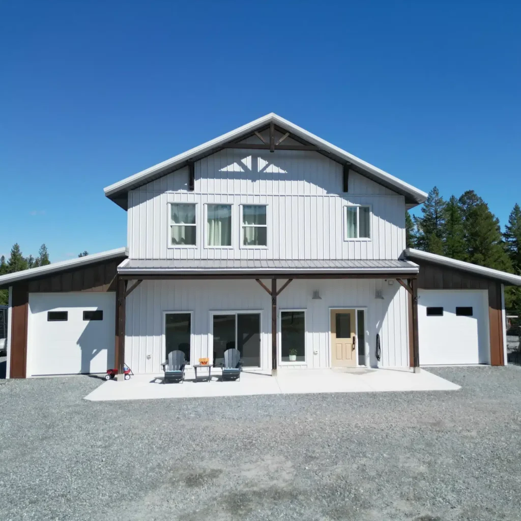 A custom white white post-frame Barndominium
