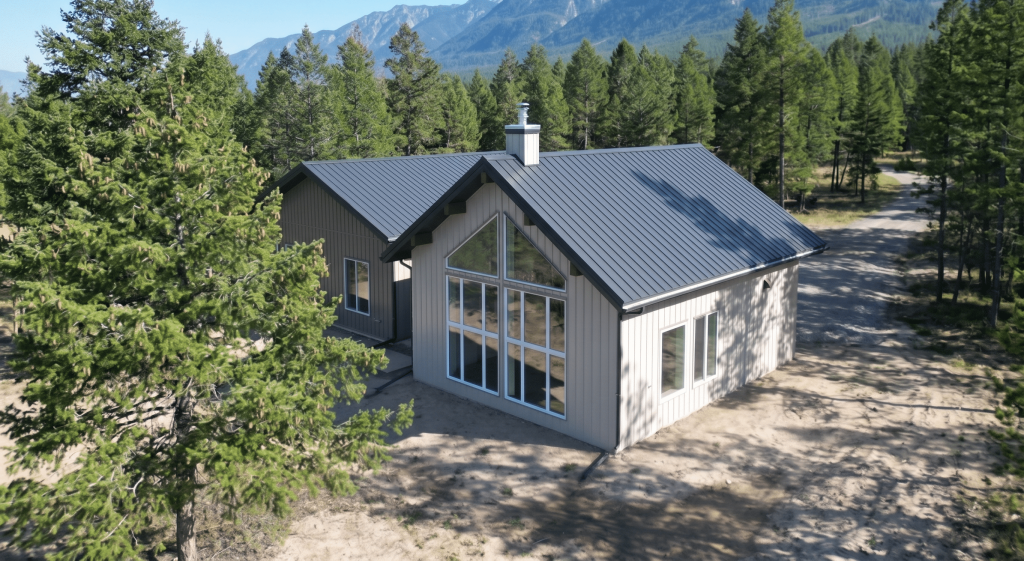 A custom residential post-frame home with soffits, and overhead doors