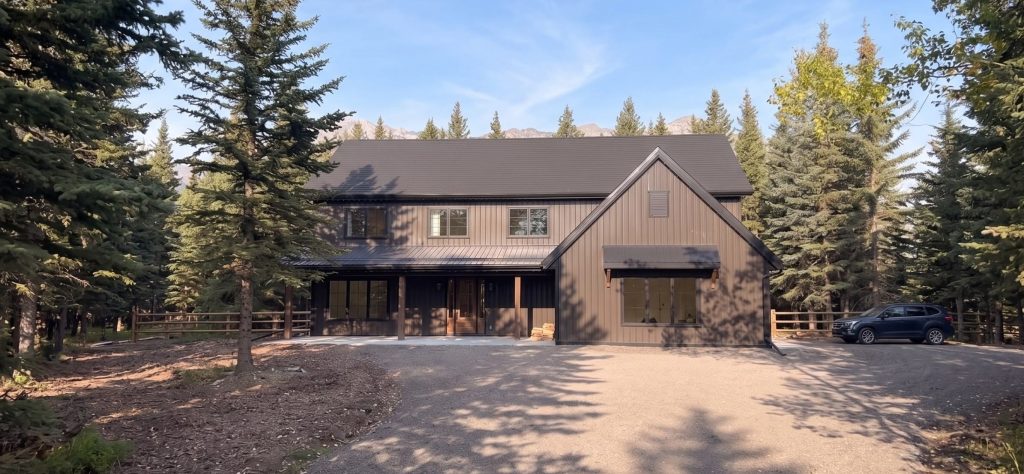 A dark brown custom post-frame residential home