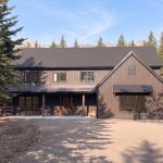 A dark brown custom post-frame residential home