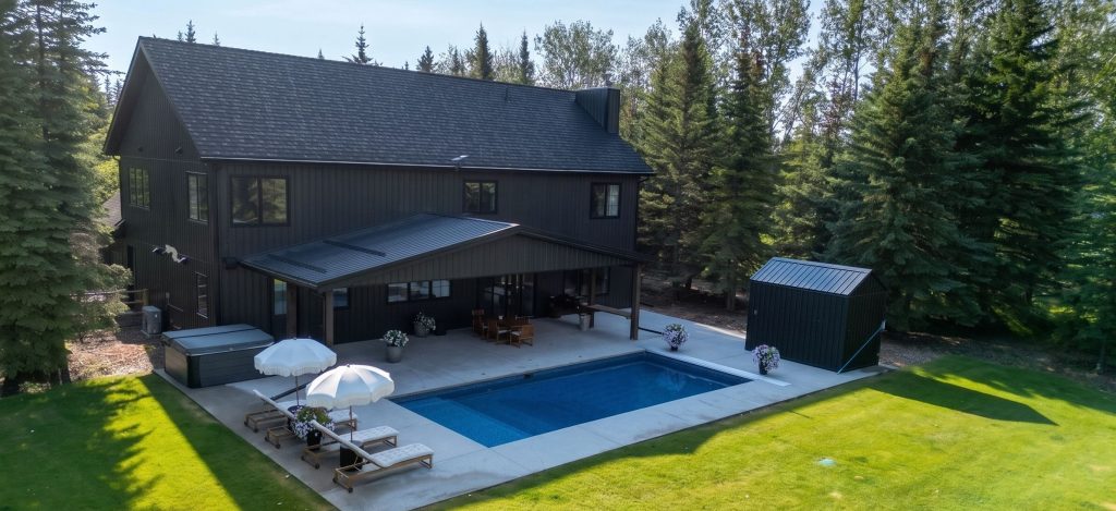 A dark brown custom post-frame residential home