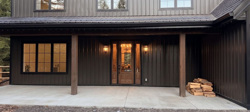 A dark brown custom post-frame residential home