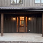A dark brown custom post-frame residential home