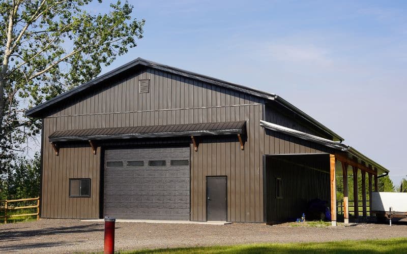 A dark brown lifestyle shop with an open lean-to and awnings