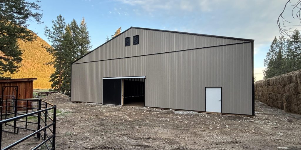 A sea wolf agriculture post-frame storage building with two sliding doors