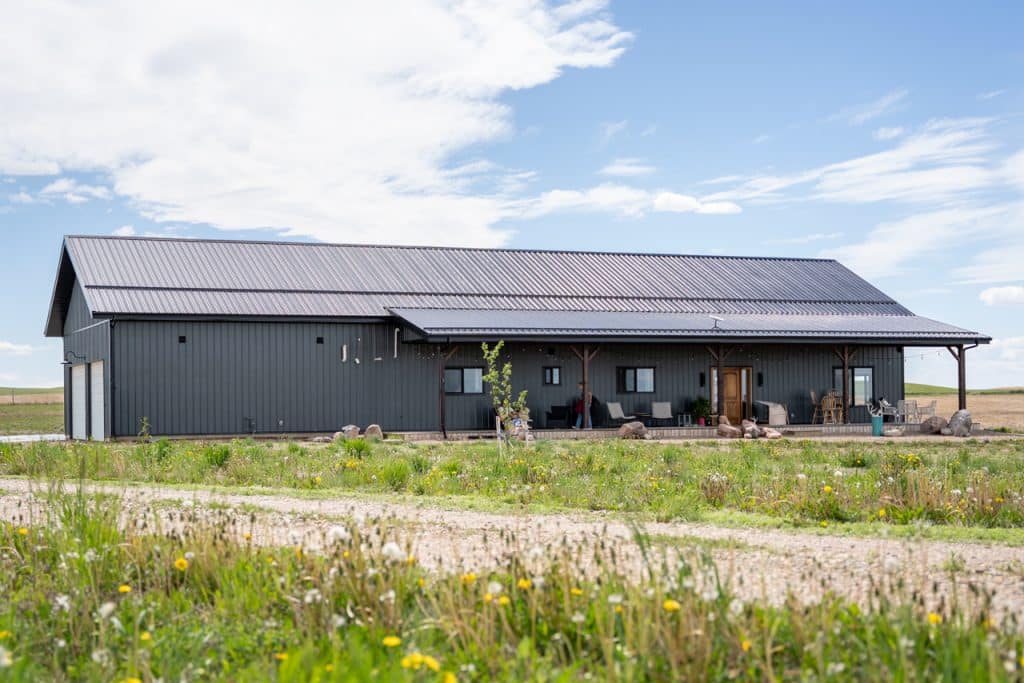 Ranch Hand with two porches and a garage built by Integrity post Structures