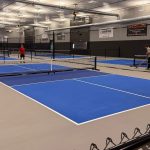 A Iron Ore post-frame Commercial Pickleball community association with premium Autumn