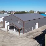 A charcoal agriculture and commercial post-frame storage shop with copper penny trims