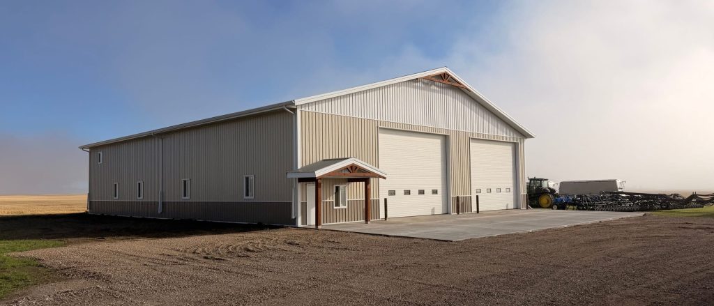 A wicker machine shed with buckskin wainscoting and overhead doors