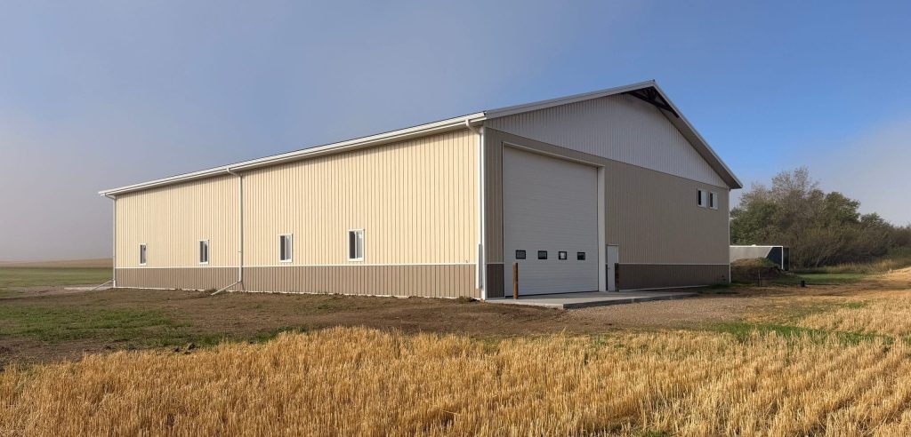 A wicker machine shed with buckskin wainscoting and overhead doors