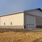 A wicker machine shed with buckskin wainscoting and overhead doors