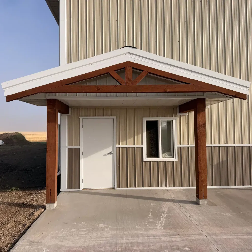 A wicker machine shed with buckskin wainscoting and overhead doors