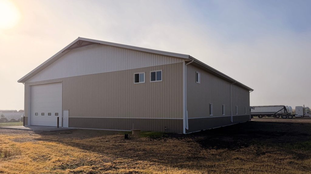 A wicker machine shed with buckskin wainscoting and overhead doors
