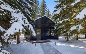A black post-frame guest house