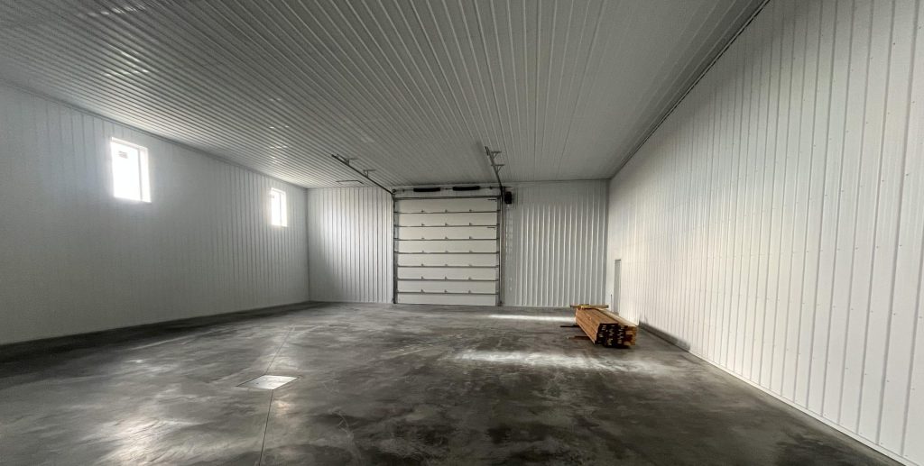 A post-frame commercial office and storage shop with wainscoting