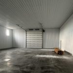 A post-frame commercial office and storage shop with wainscoting