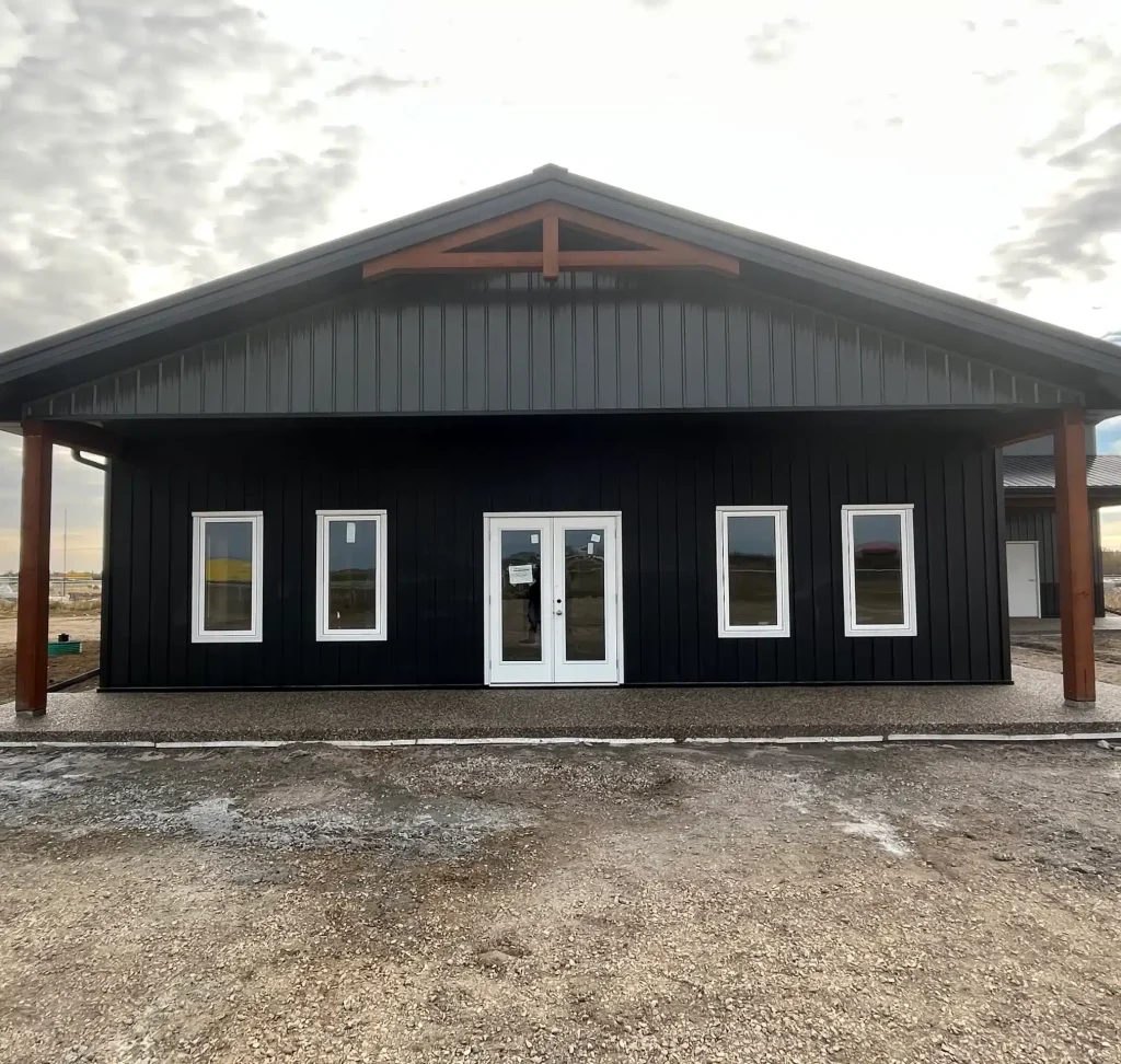 A post-frame commercial office and storage shop with wainscoting