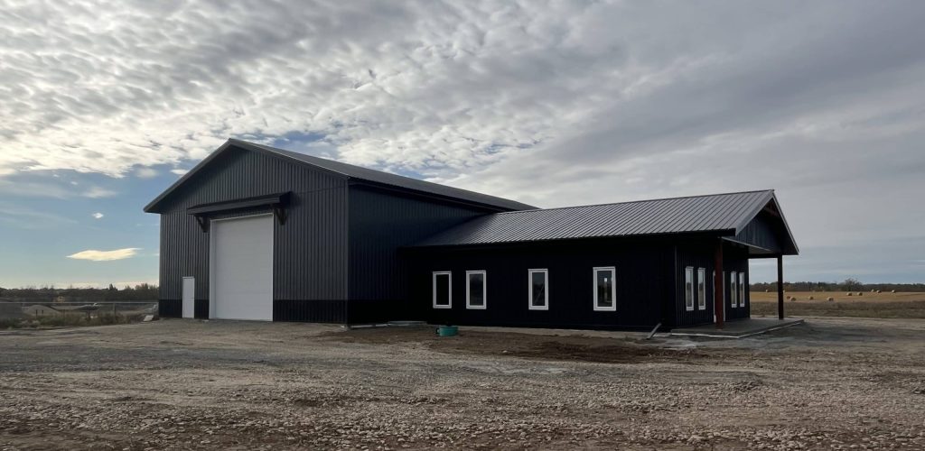 A post-frame commercial office and storage shop with wainscoting