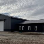 A post-frame commercial office and storage shop with wainscoting