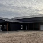 A post-frame commercial office and storage shop with wainscoting